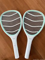 Front view of two Faicuk electric bug zapper rackets