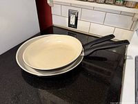 Pair of GreenPan Rio frying pans nested on countertop