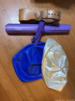 Full lot showing belt, mat, strap, blue and white balance discs