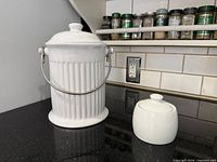 Compost keeper and sugar bowl on countertop