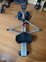 Full view of Stamina BodyTrac Glider rowing machine showing seat, arms, footplates and rail