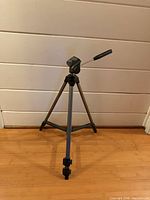 Full view of Trikon Lite-10 tripod standing on floor