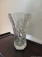 Front view of clear hexagonal vase showing Star of David pattern