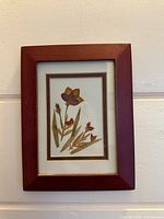 Full view of framed pressed flower art