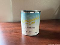 front view of sealed novelty can showing main label text