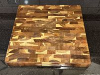 Top view of square hardwood end-grain cutting board