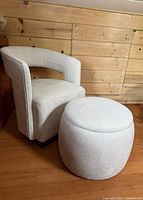 Ottoman beside chair (chair excluded) showing size and upholstery