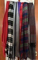 Front view displaying all nine scarves hanging side by side