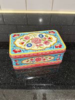 closed decorative floral metal tin
