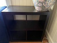 Front view of dark brown 2×2 cube shelf
