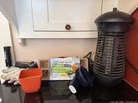 overall shot showing zapper, small trap, seed kit, gloves, pot, trowel