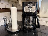 Coffee maker and paper towel holder on countertop