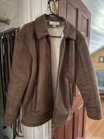 Front view of brown fleece-lined Joseph Abboud jacket hanging