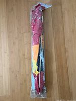 Full length view of kite in clear plastic sleeve