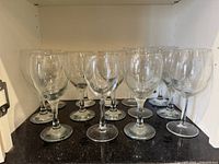 All glasses grouped on shelf showing overall quantity and style
