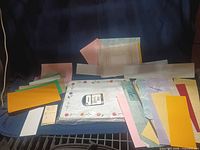 Entire assortment of papers spread out showing variety of colors, sizes and materials