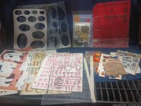 Group view showing stencils, chipboard letters, sticker sheets, metal embellishments