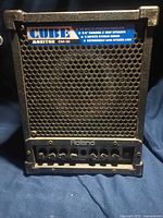 Front view of Roland CM-30 showing grille, controls and branding