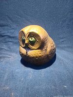 Front view of owl paperweight showing color and eye detail