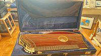 Zither inside blue-lined hard case