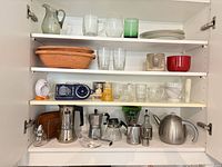 Wide view of four shelves showing majority of items