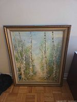 Full view of framed painting showing birch forest scene