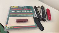 All items: sealed pocket knife, two Ka-Bar rigging knives, Victorinox knife