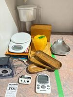 Group shot showing scale, thermometer, timers, wooden dishes, spoon rests, recipe box, cutting board, pitcher