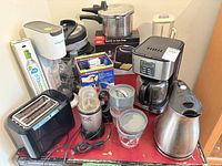 Group shot showing all appliances and cookware on table