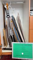 Overview showing easel and assortment of boards stored upright