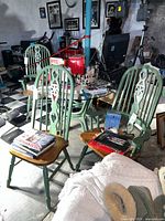 All three Windsor chairs with green painted backs and natural seats