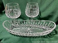 Pair of cut-crystal brandy glasses and Lismore celery dish overall view