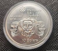 Head of Zeus reverse showing denomination, Olympiad inscription