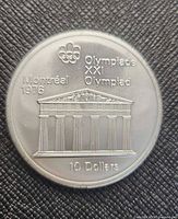 Reverse side showing Olympic rings, Temple of Zeus design and inscriptions