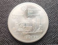 Reverse side showing Montreal skyline, Olympic rings, denomination