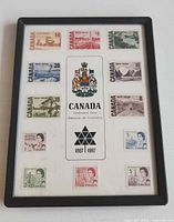 Full view of framed Centennial Issue stamp set
