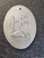 Front of token showing HB initials and beaver relief