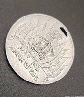 Reverse showing crown, motto, pierced hole