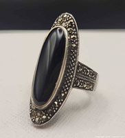 Ring profile showing black onyx cabochon and surrounding marcasite