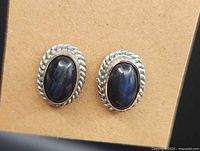 Front view showing oval labradorite stones and twisted silver bezels