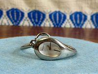 Gucci bangle watch side view showing dial and bracelet