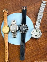 Group shot of all four watches laid out