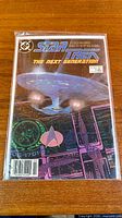 Front view of bagged Star Trek:TNG #1 comic