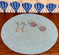 Both pairs displayed on felt pad