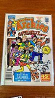 Front cover of The New Archies #1 comic book in bag and board