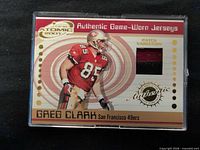 Front view of Greg Clark Prism Atomic jersey relic card in case