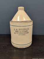 Front view showing entire stoneware flagon and printed merchant mark