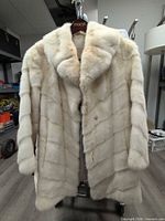 Front of ivory mink fur coat showing overall style and condition
