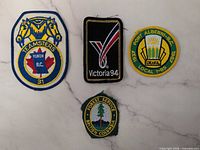 Group shot of four embroidered patches: Teamsters Yukon, Port Alberni Local 125, BC Forest Service, Victoria 94
