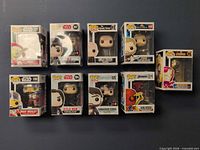 Nine Funko Pop boxes front view in two rows showing figures and box wear